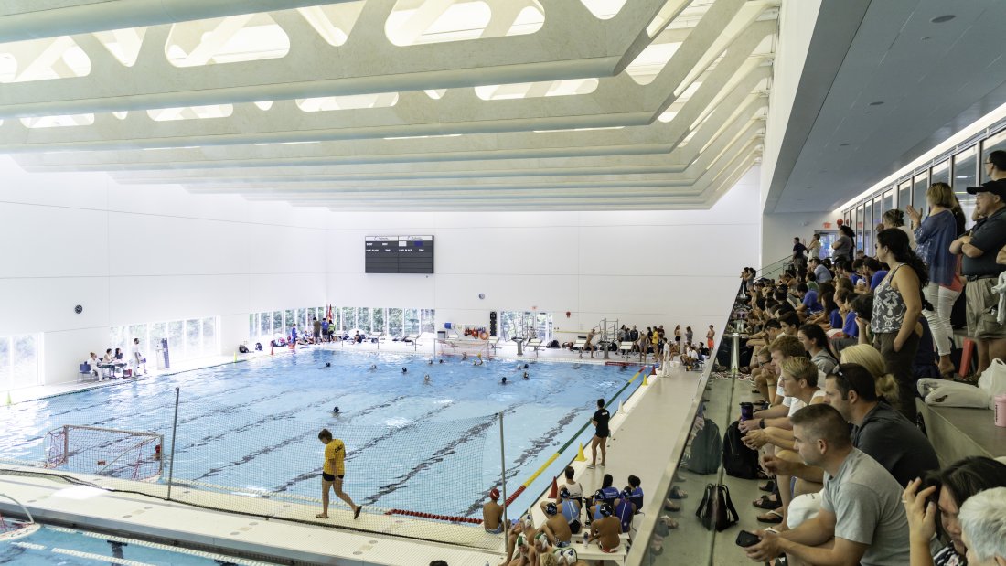 Spectators watching a swim event