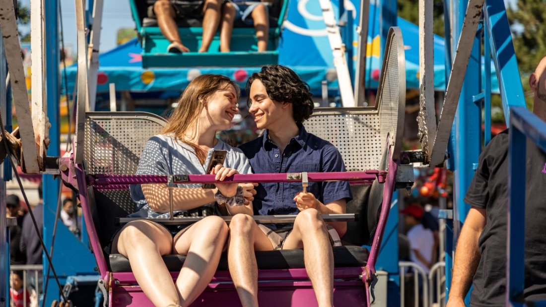 two people enjoying a ferris wheel ride