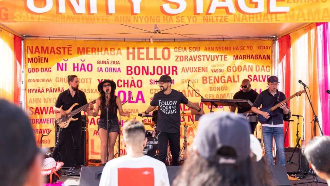 performers on stage playing music