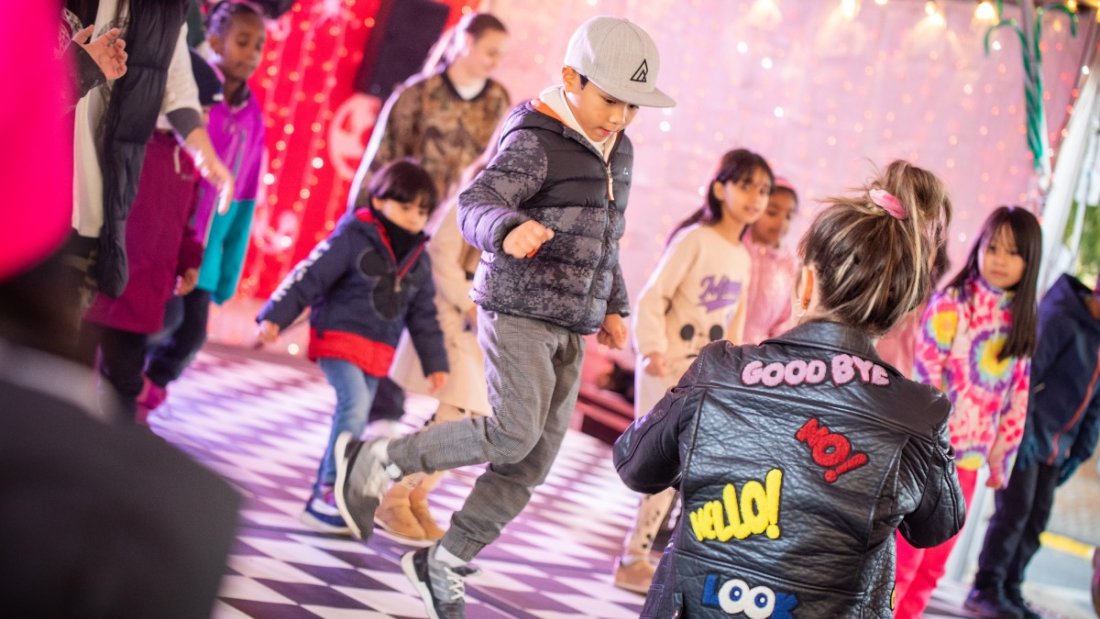 dancers on dance floor in bright colours