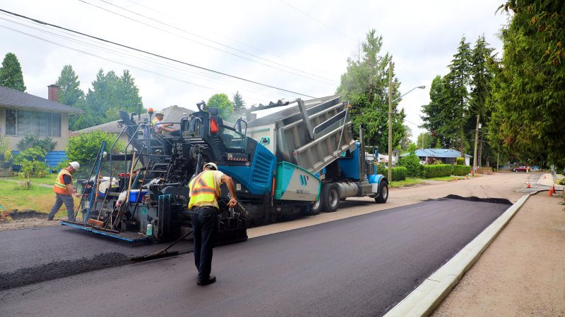 City workers pave the street