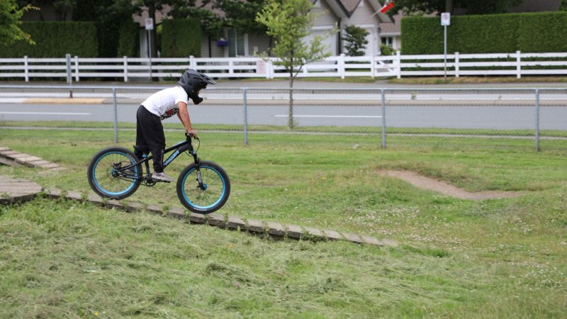 Youth on a bike at the park