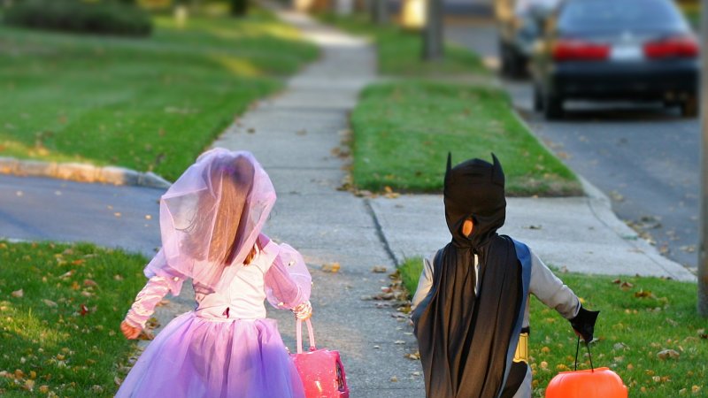 two kids in costumes