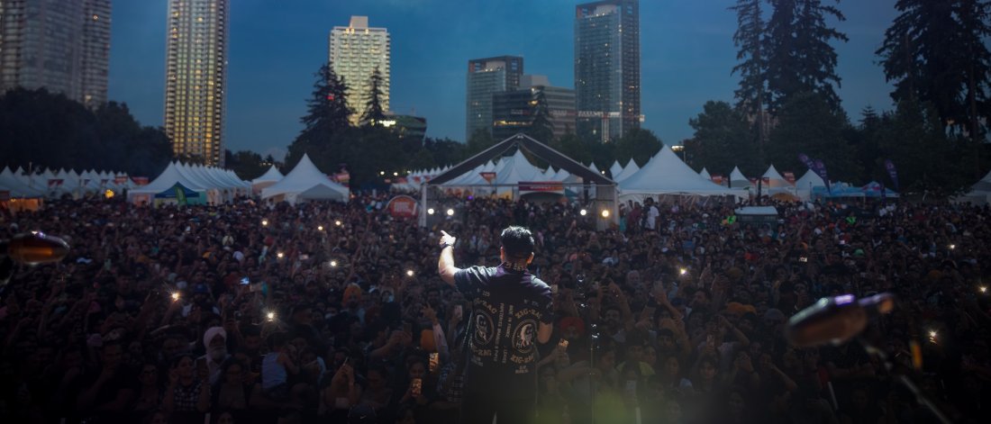 performer facing a large crowd