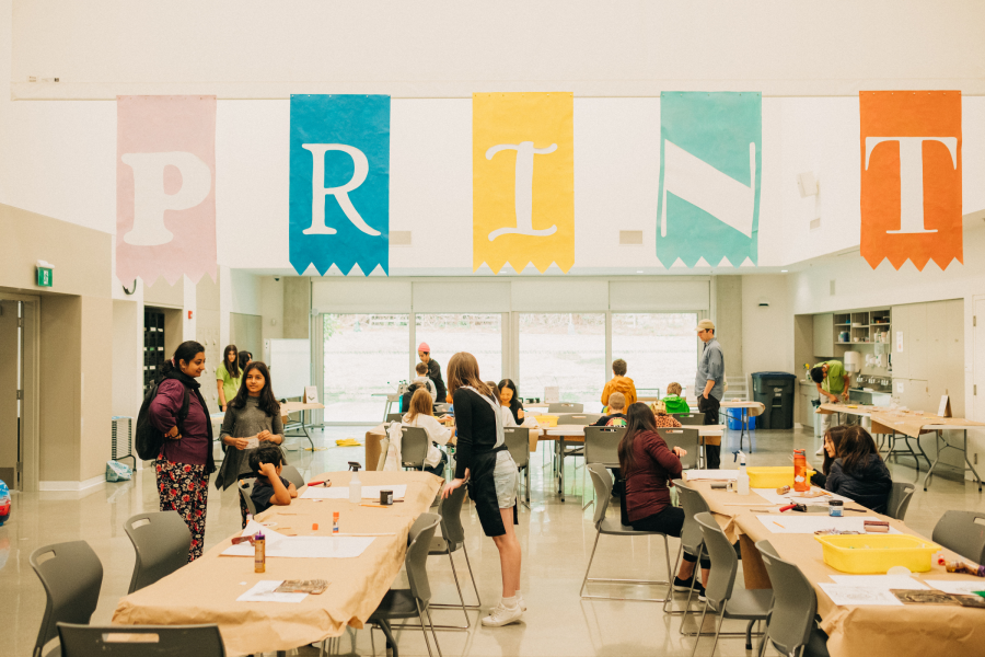 people working on a community art project in a room