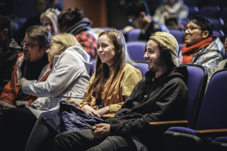 young audience members smiling