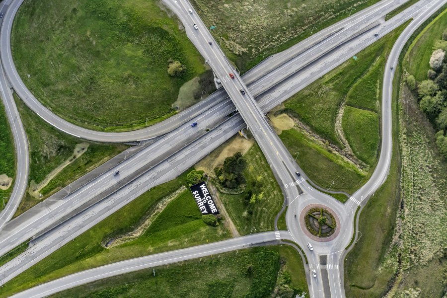 Aerial roads in Surrey with a Welcome to Surrey sign