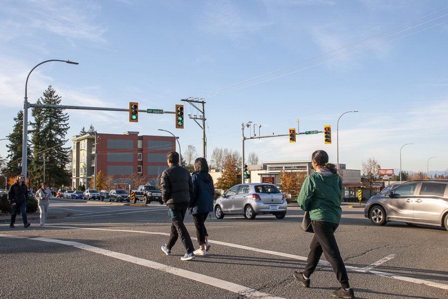 people walking at a crosswalk