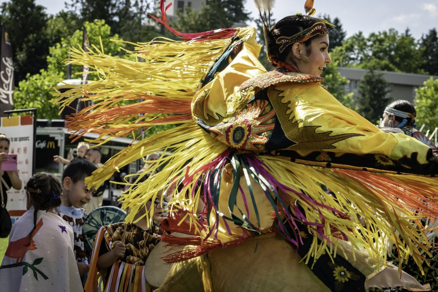 Person in colourful outfit at a festival