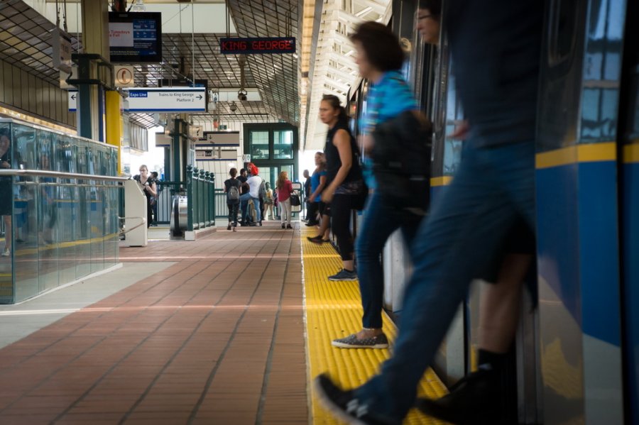 passengers walking off a skytrain