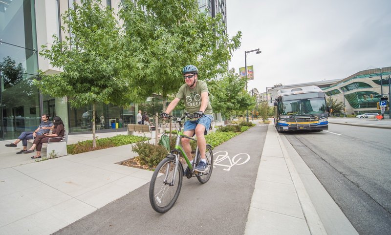 Man biking in a bike lane